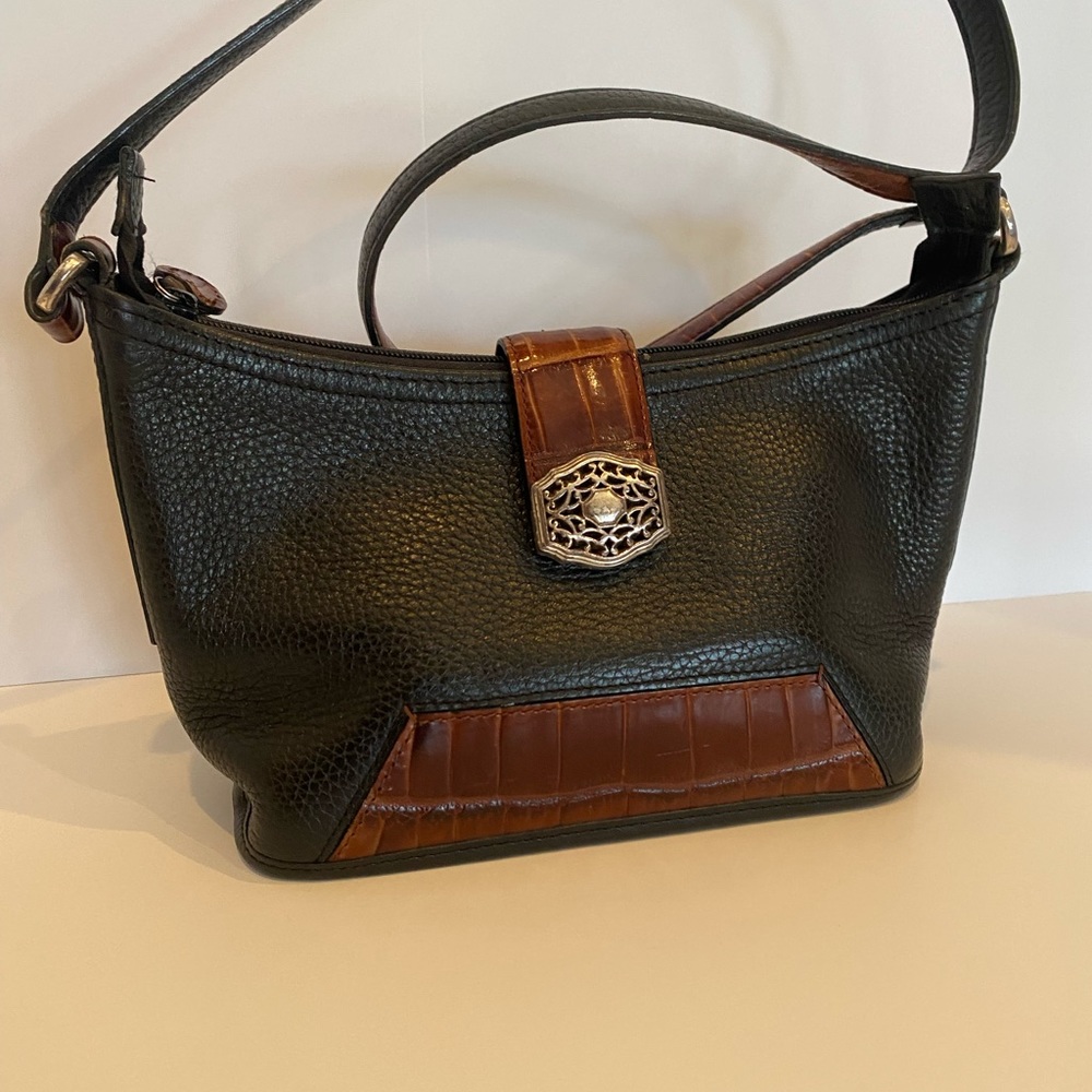 Brighton cross body zippered purse. leather strap. Clip for keys.